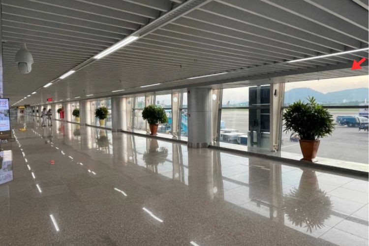 Horizontal Indoor Overhead Signage Billboard at Da Nang International Airport, Hoa Cuong Ward, Da Nang City (Decal affixed on the glass wall at Level 2, walkway leading passengers from the aircraft to the Domestic Arrivals Terminal)