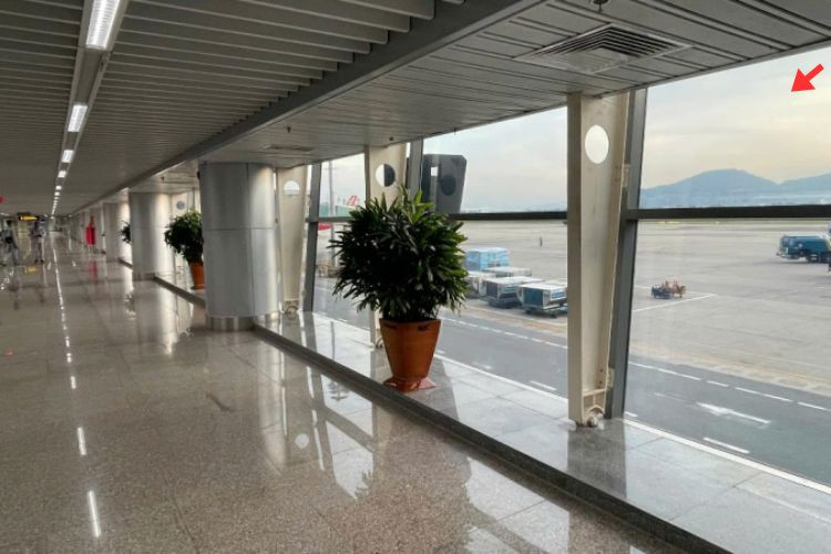 Horizontal Indoor Overhead Signage Billboard at Da Nang International Airport, Hoa Cuong Ward, Da Nang City (Decal affixed on the glass wall at Level 2, walkway leading passengers from the aircraft to the Domestic Arrivals Terminal)