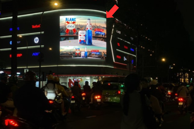 Night View - Horizontal Curved LED Screen Billboard at 63-65-67 Tran Hung Dao, Ben Thanh, Ho Chi Minh City (Nguyen Kim Electronics Shopping Center)